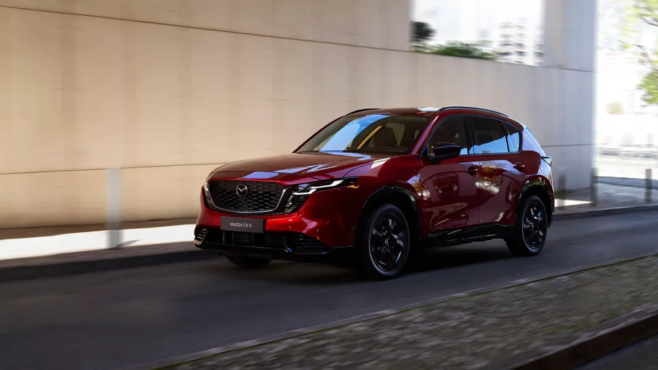 The 2027 Mazda CX-5, now with standard AWD and a starting price of $31,485, on the road.
