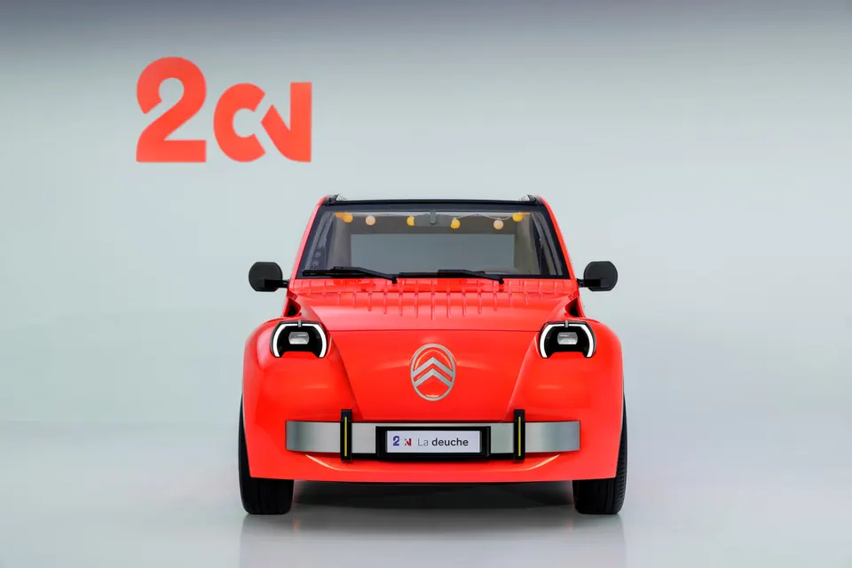The electric 2CV concept's face: simple round lights and chrome bar echo the original